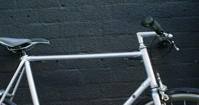 Minimalist Bicycle Parked Against Dark Brick Wall - Download Free Stock Images Pikwizard.com