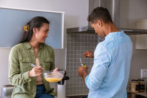 Couple Collaborating in Kitchen Baking Experience