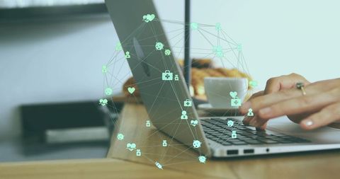 Typing Hands on Laptop with AR Health Network and Data Visualization Overlay