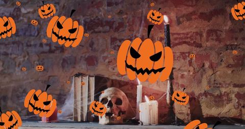 Spooky halloween jack-o'-lanterns with candles and skull