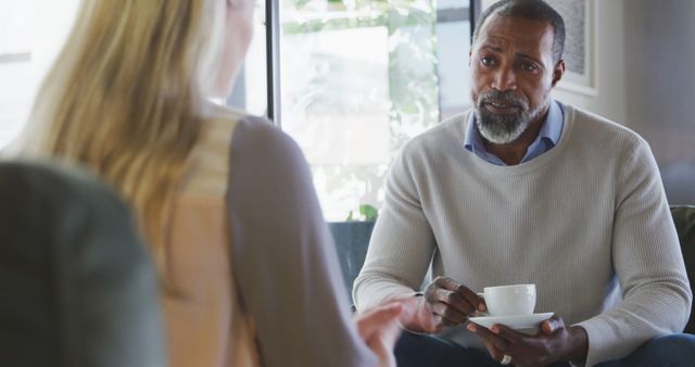 Two People Having Serious Conversation in Coffee Shop - Download Free Stock Images Pikwizard.com