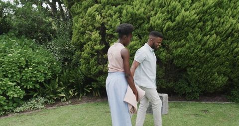 Couple Walking in Garden Enjoying Peaceful Outdoor Moment Together
