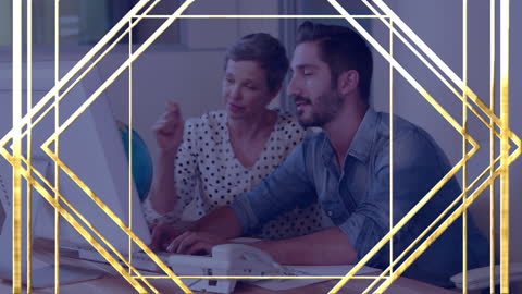 Two Casual Business People Collaborating on Laptop with Golden Frame