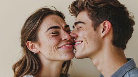 Close-up of affectionate couple smiling