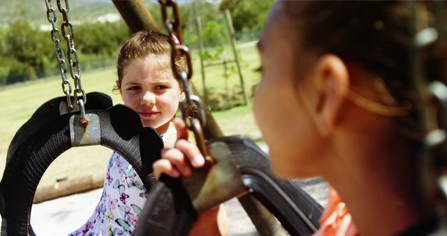 Children Enjoying Playground Swing on Sunny Day - Download Free Stock Images Pikwizard.com