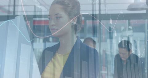 Businesswoman Analyzing Financial Data with Team in Modern Office - Download Free Stock Images Pikwizard.com