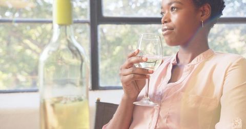 Woman Enjoying Glass of White Wine at Home - Download Free Stock Images Pikwizard.com