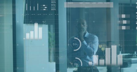 Executive Analyzing Financial Graphs in Modern Office - Download Free Stock Images Pikwizard.com