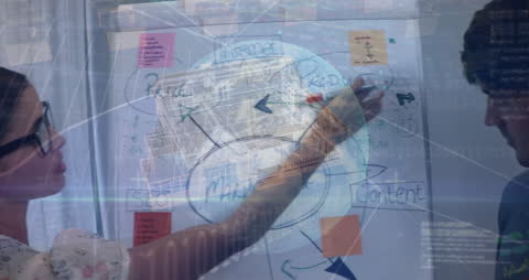 Colleagues Brainstorming Business Strategy with Technological Overlay