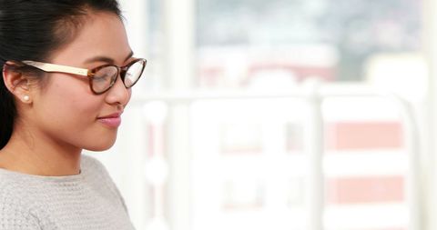 Smiling Biracial Businesswoman in Modern Office Setting