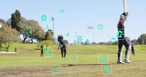 Female cricketer celebrating power shot with augmented reality eco icons in park