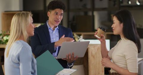 Diverse Business Team Discussing Project in Office Environment