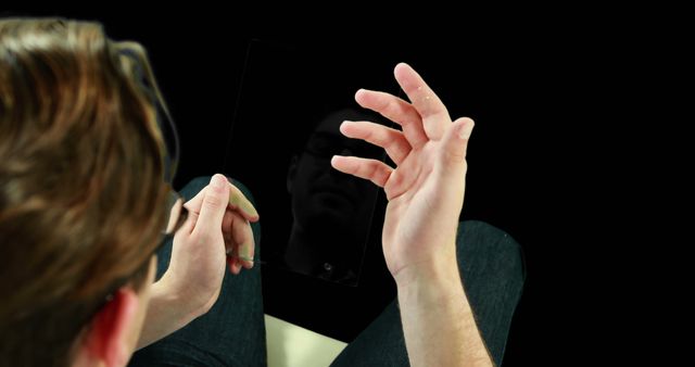 Man Using Tablet with Black Reflection Screen in Low Light - Download Free Stock Images Pikwizard.com