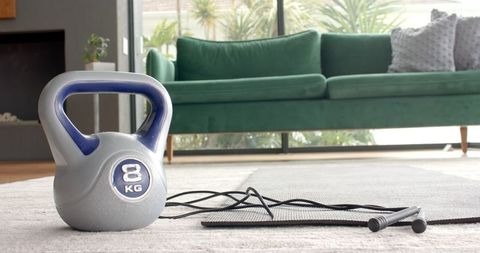 Modern Home Gym Setup with Kettlebell and Jump Rope Highlighting Lifestyle Fitness