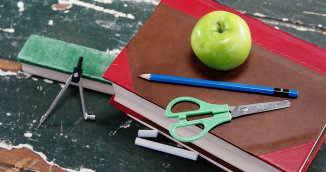 School supplies on old desk, apple, compass, scissors, books - Download Free Stock Images Pikwizard.com