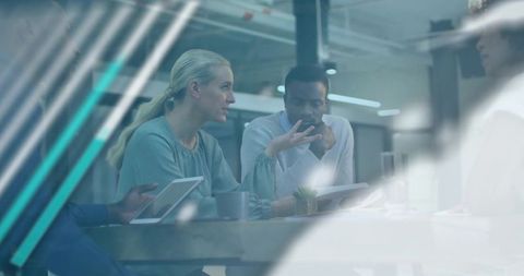 Colleagues Discussing Strategy in Modern Meeting Room