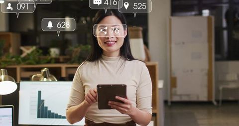 Successful Businesswoman Using Tablet in Modern Office with Data Analytics Icons