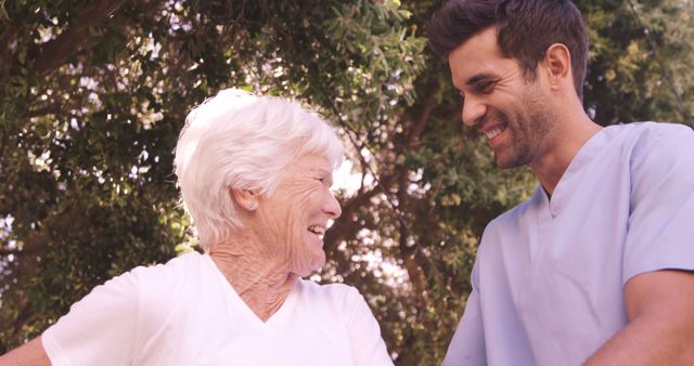 Happy Medical Professional Assisting Elderly Woman Outdoors - Download Free Stock Images Pikwizard.com