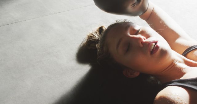 Exhausted Woman Boxer Laying on Gym Floor Taking Break - Download Free Stock Images Pikwizard.com