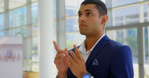 Confident Businessman Strategizing in Modern Office