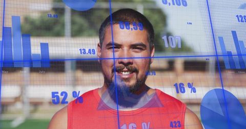 Male Athlete Wearing Red Jersey Standing on Field with Blue Data Analytics Overlay