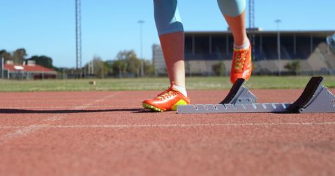 Young Female Athlete Ready for Sprint on Track - Download Free Stock Images Pikwizard.com