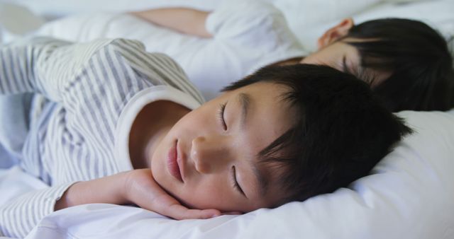 Peaceful Siblings Sleeping Together in Cozy Bed - Download Free Stock Images Pikwizard.com