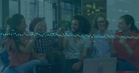 Diverse Team Cheering with Financial Data Overlay