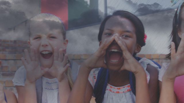 Diverse schoolchildren shouting with cloud animation overlaying faces. Use for global education themes, childhood development, and promotional materials about outdoor school activities. Highlights diversity and excitement in learning environments.