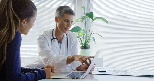 Female Doctor Consulting Patient and Discussing Results - Download Free Stock Images Pikwizard.com