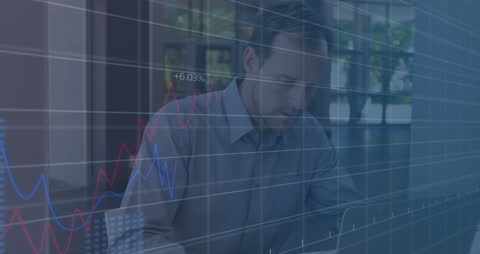 Businessman Analyzing Digital Financial Charts in Office