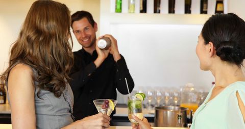 Friends Enjoying Cocktails at Trendy Local Bar