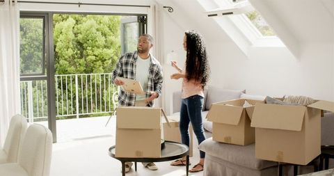 Couple Unpacking in Their New Home Bright Living Room