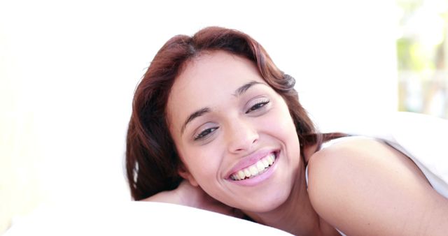 Happy woman waking up at home in the bedroom 