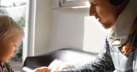 Father and child bonding at home, relaxing atmosphere