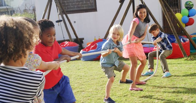 Children Playing Tug of War in Vibrant Outdoor Setting - Download Free Stock Images Pikwizard.com