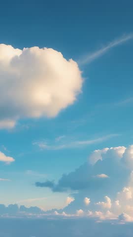 Wind lifting cumulus clouds with cirrus streak in vertical high-altitude sky