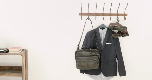 Coat and Bag Hanging on Hooks in Minimalist Entryway - Download Free Stock Images Pikwizard.com