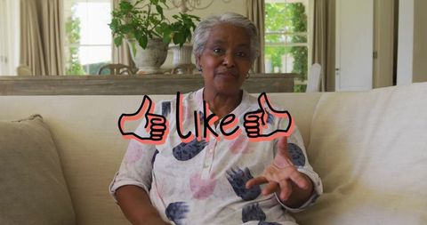 Senior Woman Relaxing on Beige Couch with Natural Light