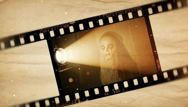 Vintage 35mm film projector casting ghostly nun with skull makeup on aged parchment horror