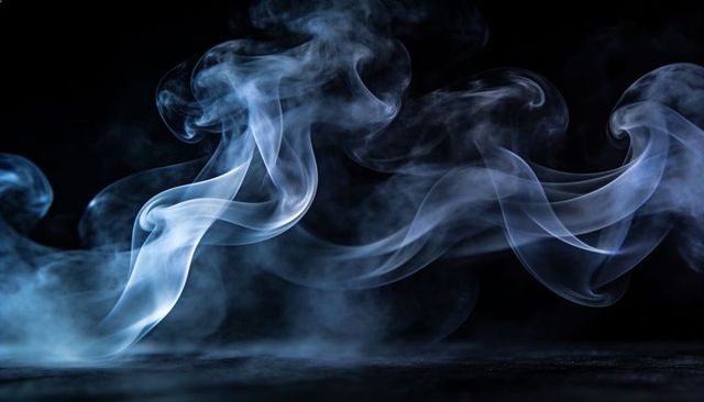 Swirling cyan smoke ribbons flowing across reflective black surface creating ethereal mist