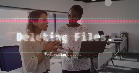 Diverse Businesswomen Collaborating with Digital Interface in Modern Office