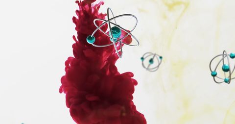 Abstract molecular structures over red ink cloud on white background