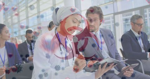 Medical Team Discussing with COVID-19 Virus Overlay