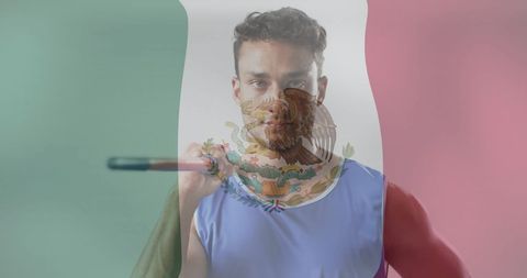 Mexican athlete holding javelin showing determination and patriotism