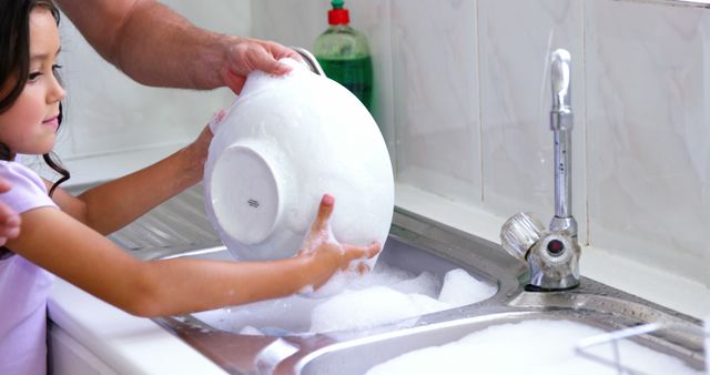 Father and Young Child Washing Dishes Together - Download Free Stock Images Pikwizard.com