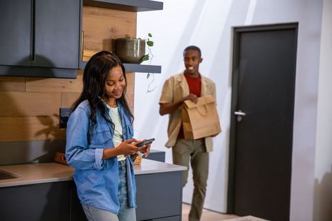 African American Couple in Modern Kitchen Enjoying Flexibility
