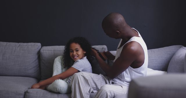 Father Braiding Daughter's Hair on Couch and Smiling - Download Free Stock Images Pikwizard.com