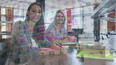 Smiling Female Coworkers with Binary Code Overlay in Library