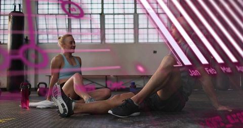 Woman and man resting after workout in industrial gym with magenta graphic overlay